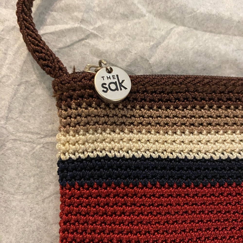 The Sak Crochet Wristlet in Brown, Cream, Navy & Red